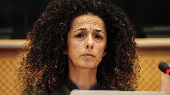 Iranian journalist and writer Masih Alinejad listens during an event at European Parliament headquarters in Brussels in 2016.