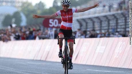 Anna Kiesenhofer crossed the finish line to win the women&#39;s cycling road race of the Tokyo Olympics on Sunday. 