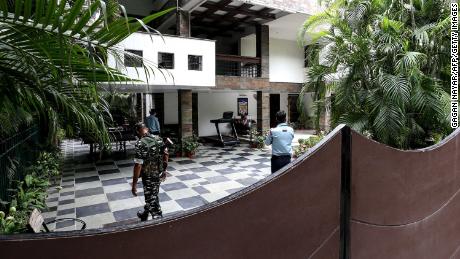 Security personnel at the Bhopal home of Sudhir Agrawal, managing director of Dainik Bhaskar. His residence was raided by Indian officials as part of a tax investigation. 