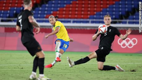 Richarlison (#10) scores Brazil&#39;s third goal during the men&#39;s first round Group D match against Germany during the Tokyo 2020 Olympic Games at the International Stadium Yokohama on July 22, 2021 in Yokohama, Tokyo, Japan. .