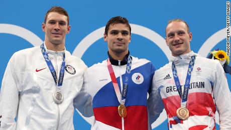 Murphy (left), Rylov (middle) and Greenbank (right) pose on the podium during the medal ceremony for the men&#39;s 200m backstroke final.