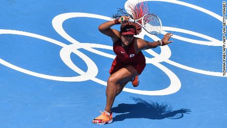 Osaka hits a forehand as she makes a winning start to the Tokyo Olympics. 