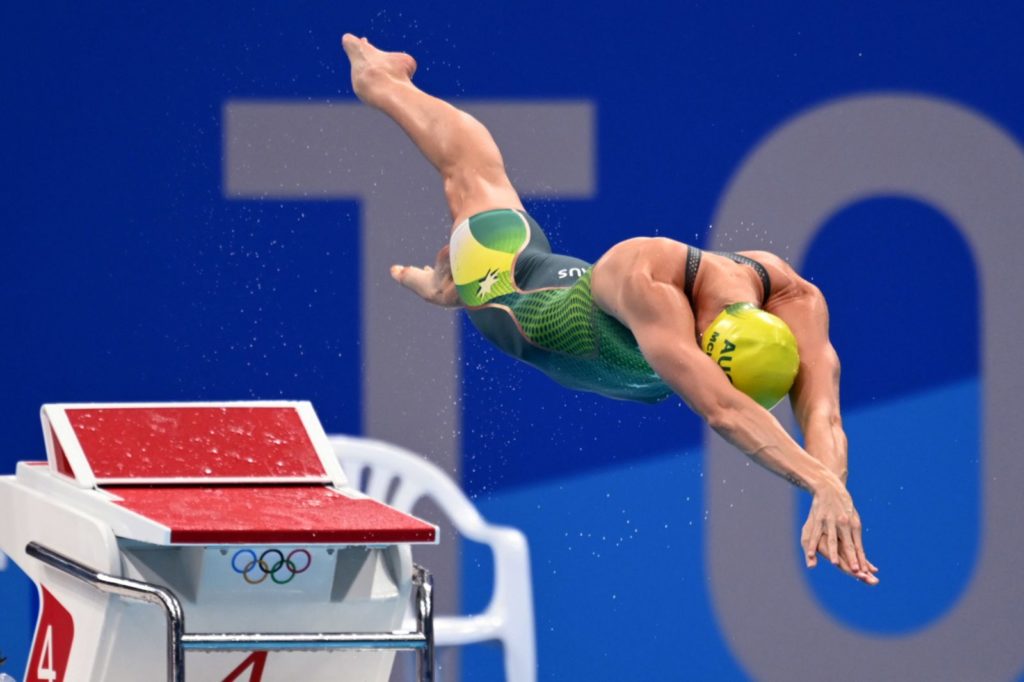 Australian swimmer Emma McKeon dives into the pool at the start of the 50-meter freestyle final on August 1. She won her third gold in Tokyo and set an Olympic record time of 23.81 seconds.