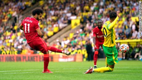 Liverpool&#39;s Mohamed Salah scores his side&#39;s third goal of the game in the 3-0 win against Norwich.