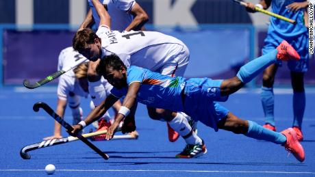 India&#39;s Vivek Sagar Prasad and Germany&#39;s Tobias Constantin Hauke compete for possession during the men&#39;s hockey bronze medal match. 