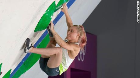 Garnbret competes in the bouldering element of the women&#39;s sport climbing final.