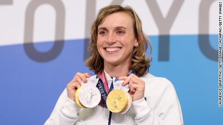 Ledecky poses with her two gold and two silver medals at the Tokyo Olympics.