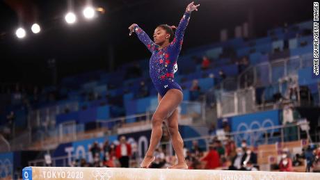 Biles competes on the balance beam during women&#39;s qualification on day two of the Tokyo 2020 Olympic Games.