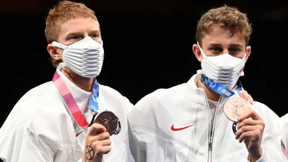 Race Imboden (far left) and his US teammates pose with their bronze medals  in the men's foil team event at the 2020 Summer Olympics in Tokyo, Japan.