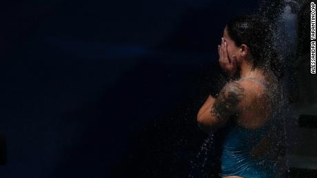Ingrid Oliveira of Brazil takes a shower after competing in women&#39;s diving 10-meter platform preliminary at the Tokyo Olympics on August 4.